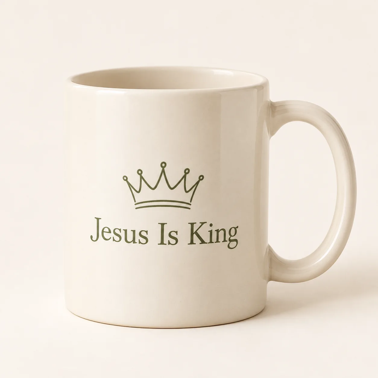 Jesus Is King Christian Coffee Mug – Crown Design – Design Preview Ivory Jesus Is King Christian coffee mug with a sage crown illustration